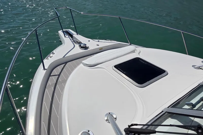  Yacht Photos Pics 2007 Boston Whaler 305 Conquest boat deck on calm water.