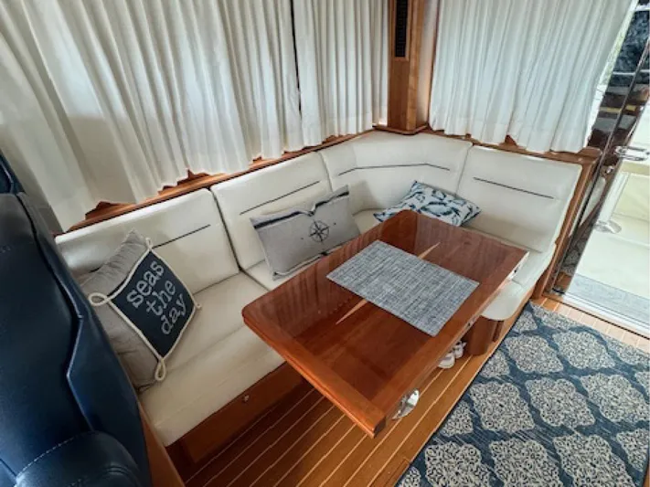 Andante III Yacht Photos Pics Interior of 2017 Sabre 45 Salon Express with cozy seating and nautical decor.