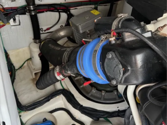 Andante III Yacht Photos Pics Engine compartment of 2017 Sabre 45 Salon Express with visible hoses and wiring.