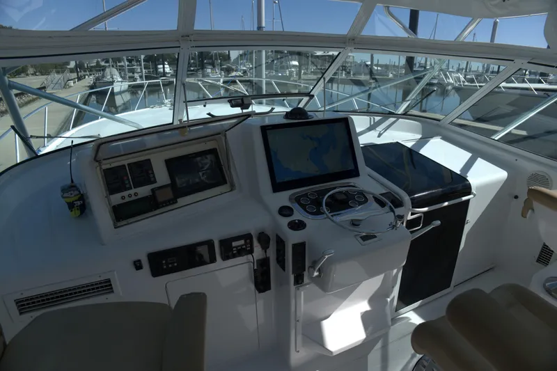 Blueprint Yacht Photos Pics Helm of 2002 Viking 43 Open yacht with navigation equipment and controls.