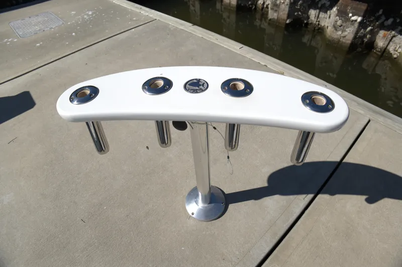 Blueprint Yacht Photos Pics Rod holder on 2002 Viking 43 Open boat docked by the water.