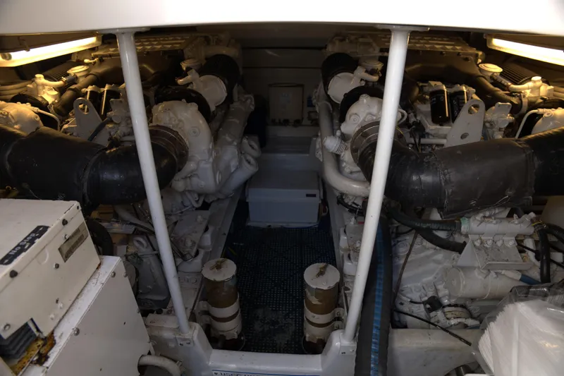 Blueprint Yacht Photos Pics Engine room of 2002 Viking 43 Open yacht, showcasing dual engines and mechanical components.