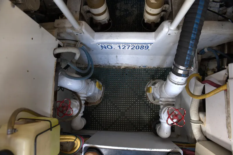 Blueprint Yacht Photos Pics Engine room of 2002 Viking 43 Open boat with visible piping and valves.