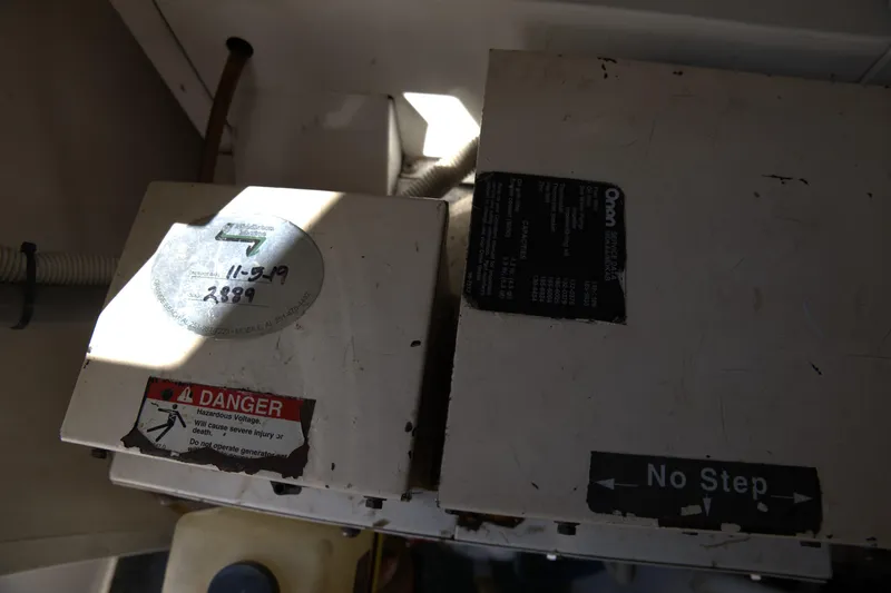 Blueprint Yacht Photos Pics Electrical panel with warning labels inside a 2002 Viking 43 Open boat.