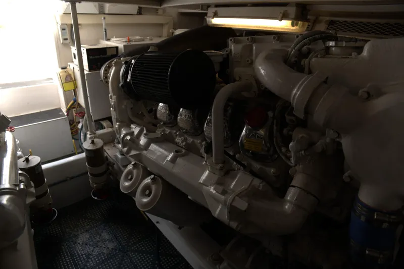 Blueprint Yacht Photos Pics Engine room of a 2002 Viking 43 Open yacht, showcasing mechanical components.