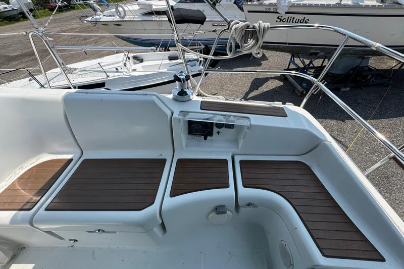  Yacht Photos Pics Cockpit of 2007 Beneteau Oceanis Clipper 373 with wooden seating and steering controls.
