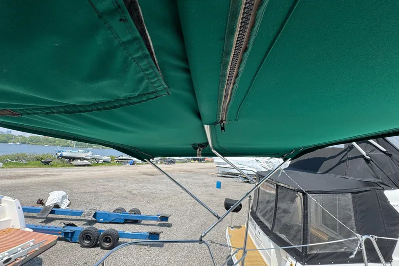  Yacht Photos Pics Green canopy on a 2007 Beneteau Oceanis Clipper 373 sailboat, dockside view.