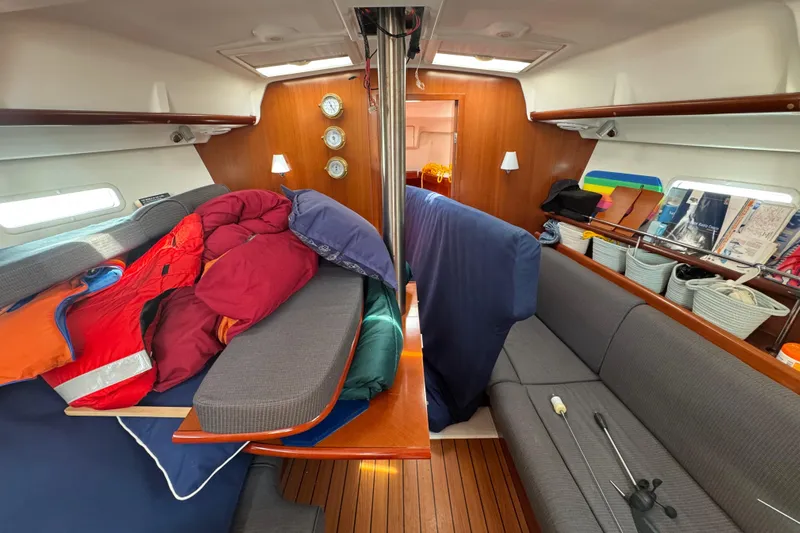  Yacht Photos Pics Interior of 2007 Beneteau Oceanis Clipper 373 sailboat with cozy seating and nautical decor.