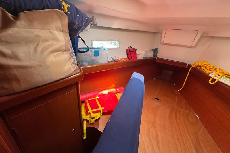  Yacht Photos Pics Cozy cabin interior of 2007 Beneteau Oceanis Clipper 373 sailboat with storage and seating.
