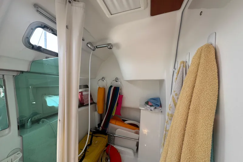  Yacht Photos Pics Interior of 2007 Beneteau Oceanis Clipper 373 bathroom with shower and towels.