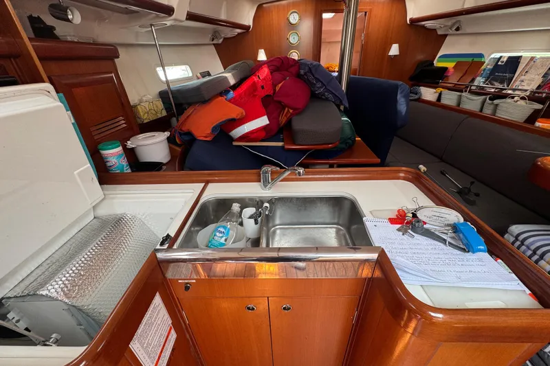  Yacht Photos Pics Interior of 2007 Beneteau Oceanis Clipper 373 yacht with kitchen and seating area.