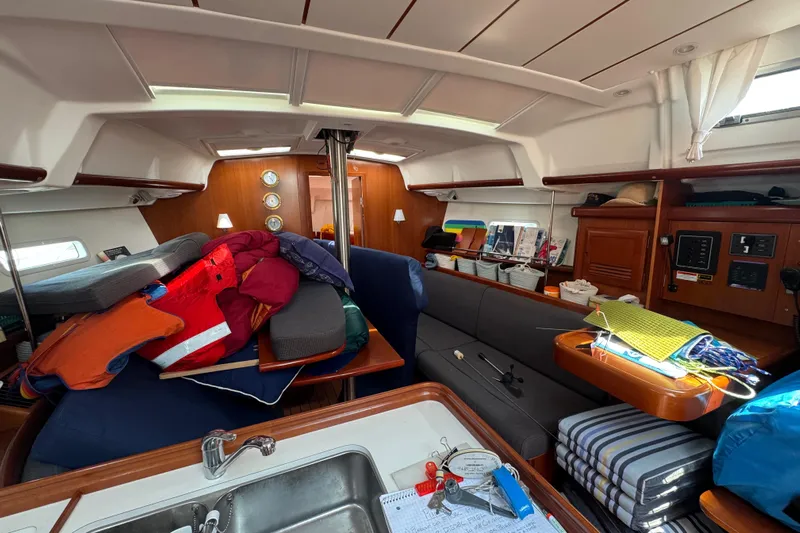  Yacht Photos Pics Interior of 2007 Beneteau Oceanis Clipper 373 sailboat with cozy seating and nautical decor.