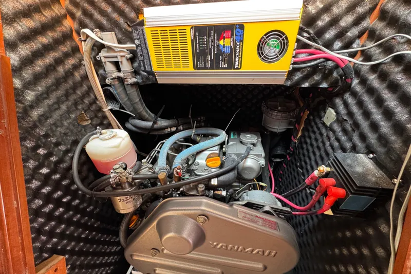  Yacht Photos Pics Engine compartment of 2007 Beneteau Oceanis Clipper 373 with Yanmar engine and charger.