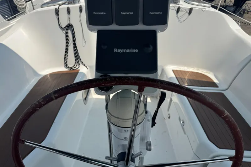  Yacht Photos Pics Steering wheel and navigation equipment on 2007 Beneteau Oceanis Clipper 373 sailboat.