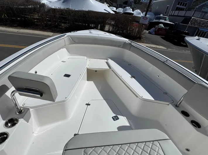  Yacht Photos Pics 2025 Pursuit S 268 boat interior with seating and storage compartments.