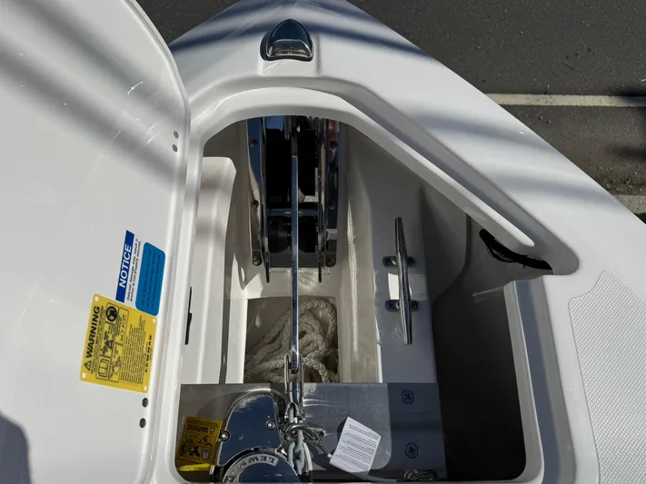  Yacht Photos Pics 2025 Pursuit S 268 boat anchor compartment with rope and winch system.