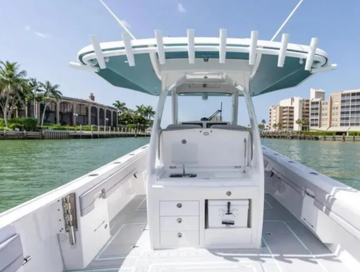  Yacht Photos Pics 2023 Intrepid 375 boat on water, featuring sleek design and spacious deck.