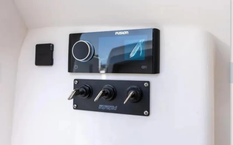  Yacht Photos Pics Control panel of a 2023 Intrepid 375 boat with Fusion audio system.