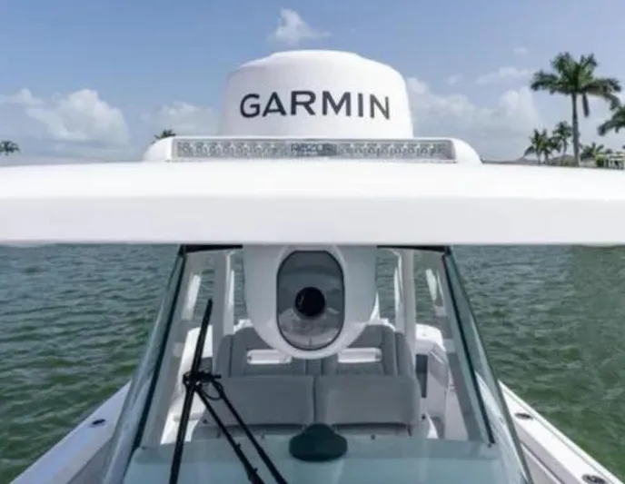  Yacht Photos Pics 2023 Intrepid 375 boat with Garmin radar, on a sunny day by the water.