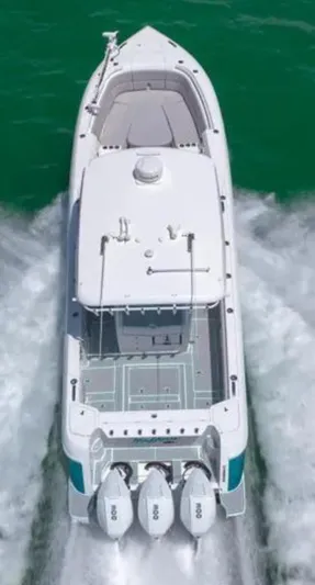  Yacht Photos Pics 2023 Intrepid 375 boat cruising on water, aerial view, triple outboard engines.