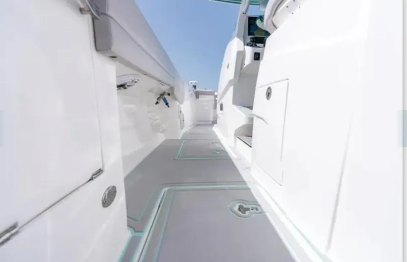  Yacht Photos Pics 2023 Intrepid 375 boat interior with sleek white design and modern features.
