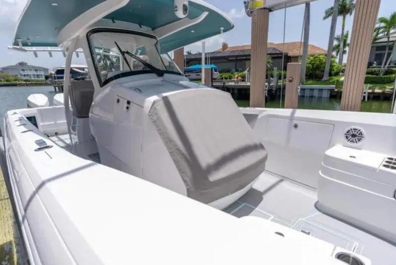  Yacht Photos Pics 2023 Intrepid 375 boat docked, featuring sleek design and spacious deck.