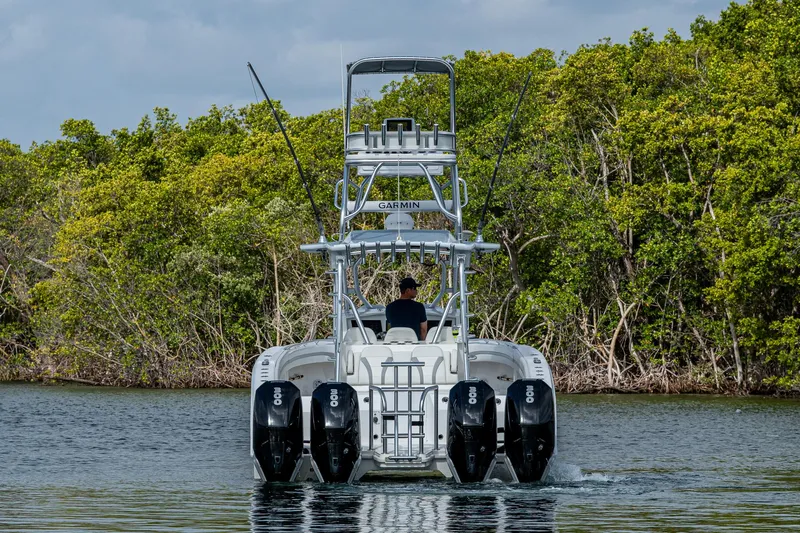  Yacht Photos Pics 2023 Prowler Renaissance 36 boat with multiple engines cruising on a calm waterway.