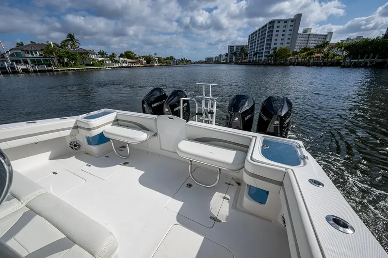  Yacht Photos Pics 2023 Prowler Renaissance 36 boat with spacious deck and multiple outboard engines on a scenic waterway.