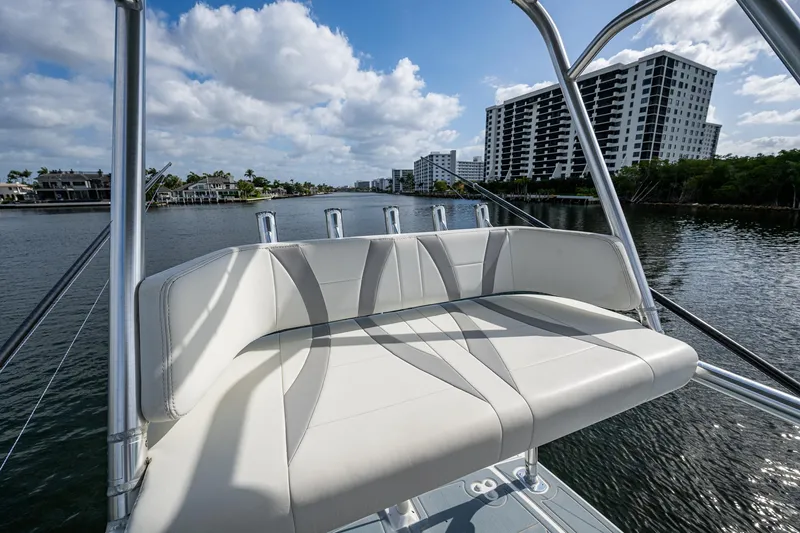  Yacht Photos Pics Luxury seating on 2023 Prowler Renaissance 36 boat, with waterfront cityscape background.