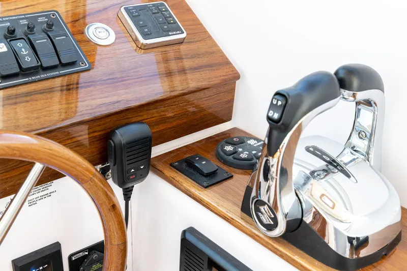 Dealer Demo Yacht Photos Pics Control panel of a 2020 True North 34 boat with wooden accents and modern controls.