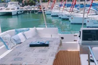 Leopard 43 Powercat 2020 yacht interior with marina view, featuring a cozy seating area.