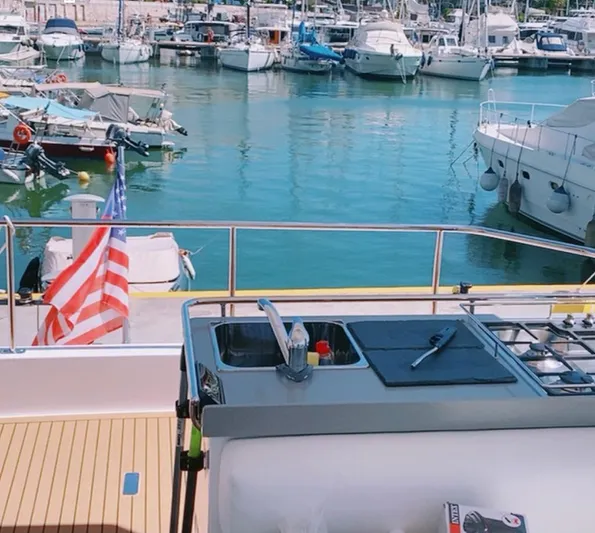  Yacht Photos Pics Leopard 43 Powercat 2020 yacht with outdoor kitchen, docked in a marina.