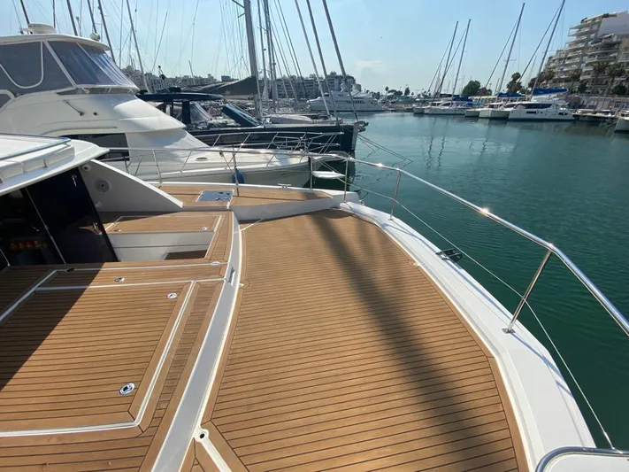  Yacht Photos Pics 2020 Leopard 43 Powercat docked, showcasing spacious deck and marina view.