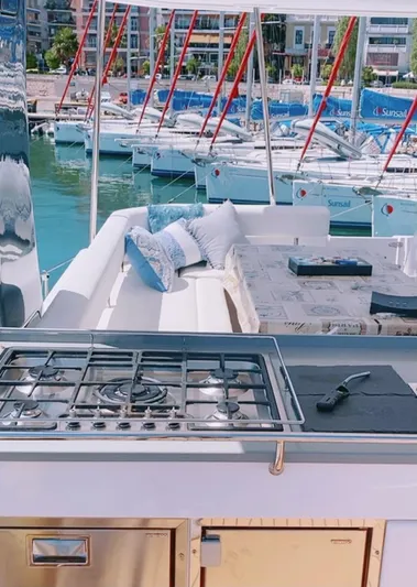  Yacht Photos Pics Leopard 43 Powercat 2020 yacht with outdoor kitchen and seating area in marina.