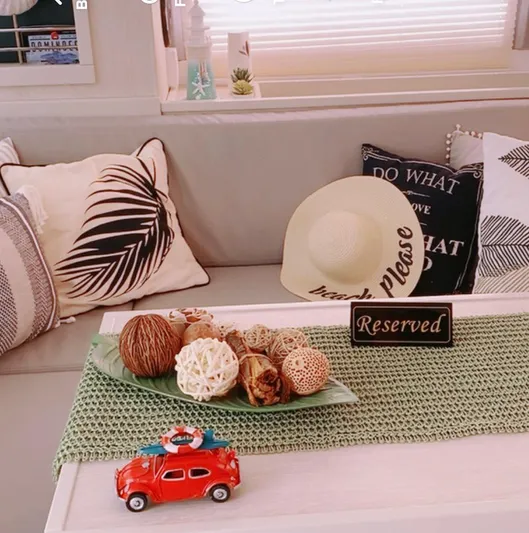  Yacht Photos Pics Cozy Leopard 43 Powercat interior with decorative pillows, hat, and table centerpiece.