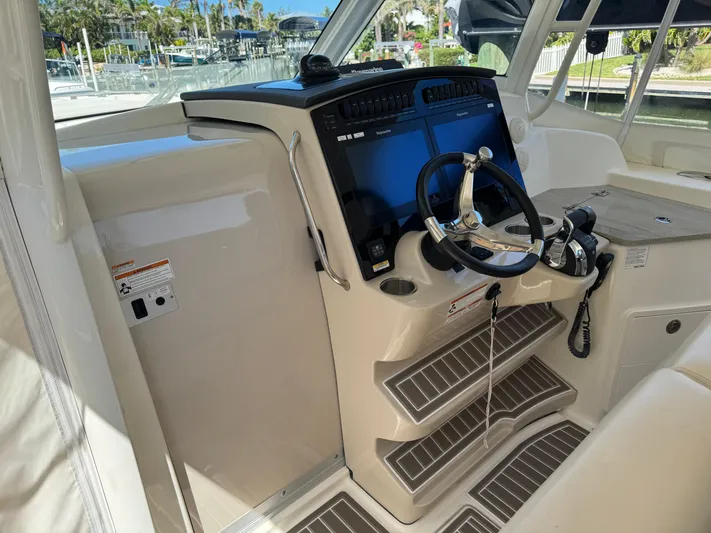  Yacht Photos Pics 2018 Boston Whaler 350 Realm helm with modern controls and navigation screens.
