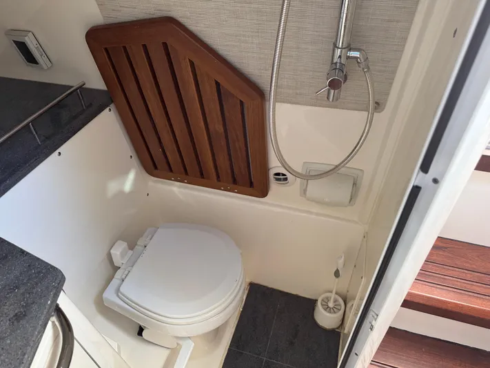  Yacht Photos Pics Compact bathroom in 2018 Boston Whaler 350 Realm boat with toilet and shower.