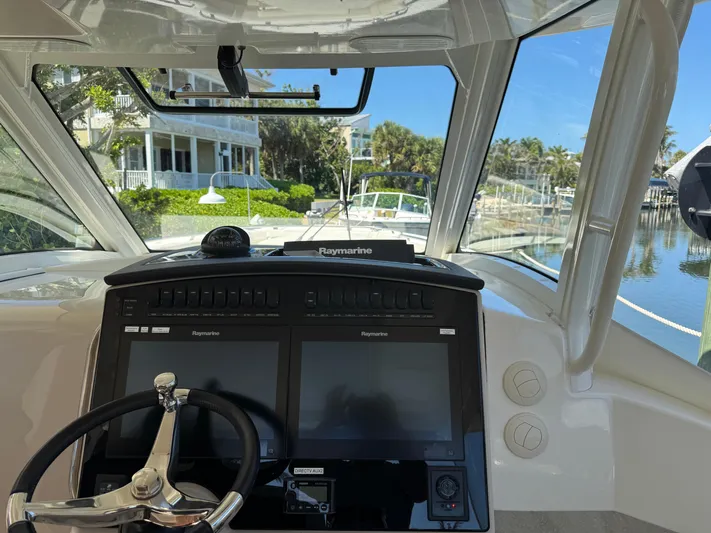  Yacht Photos Pics Cockpit view of 2018 Boston Whaler 350 Realm with Raymarine navigation system.