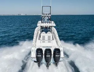  Yacht Photos Pics 2022 Invincible 36 Open Fisherman boat speeding on open water.