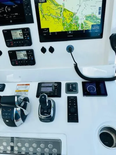  Yacht Photos Pics Control panel of 2022 Invincible 36 Open Fisherman with navigation screens and controls.