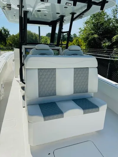  Yacht Photos Pics 2022 Invincible 36 Open Fisherman boat with cushioned seating and modern design.