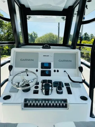  Yacht Photos Pics 2022 Invincible 36 Open Fisherman dashboard with Garmin navigation systems.