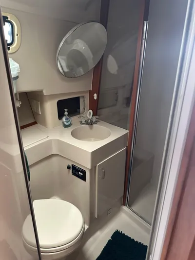 River Miss Yacht Photos Pics 1997 Mainship 350 yacht bathroom with sink, toilet, and shower.