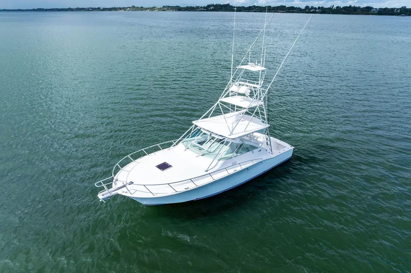 Pescador Yacht Photos Pics 2004 Cabo 40 Hardtop Express boat on calm water, aerial view.