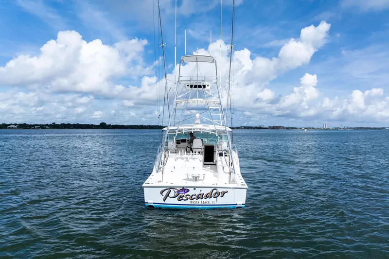 Pescador Yacht Photos Pics 2004 Cabo 40 Hardtop Express boat on open water under a blue sky.
