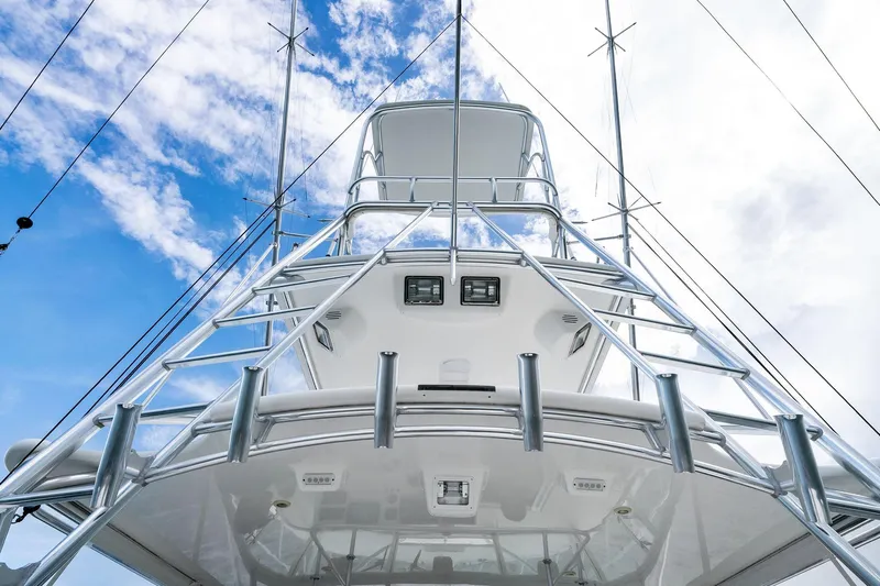 Pescador Yacht Photos Pics 2004 Cabo 40 Hardtop Express yacht, viewed from below against a blue sky.