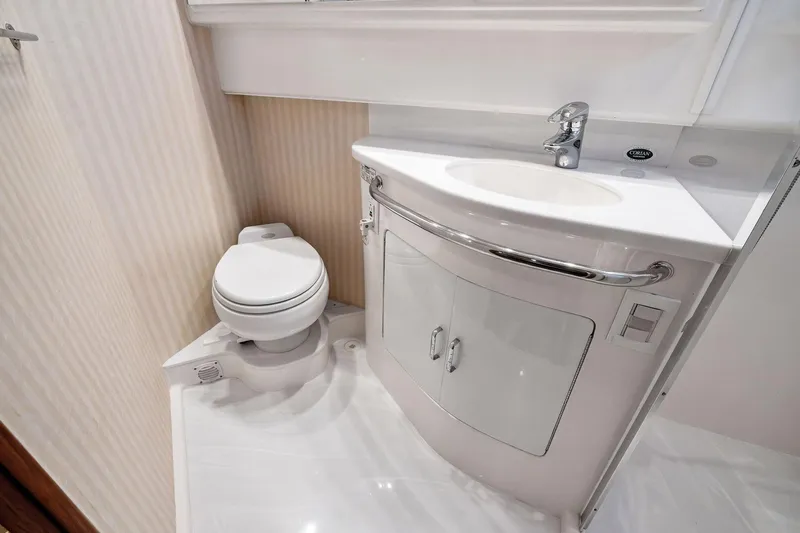 Pescador Yacht Photos Pics 2004 Cabo 40 Hardtop Express bathroom with modern sink and toilet.