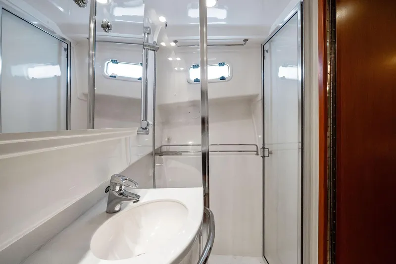 Pescador Yacht Photos Pics Luxurious bathroom in 2004 Cabo 40 Hardtop Express yacht with modern fixtures and shower.