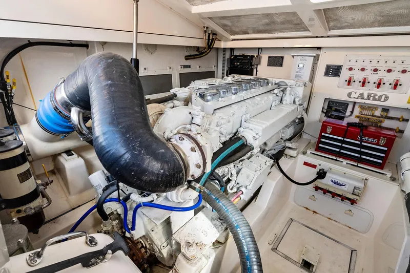 Pescador Yacht Photos Pics Engine room of 2004 Cabo 40 Hardtop Express, showcasing detailed machinery and control panels.