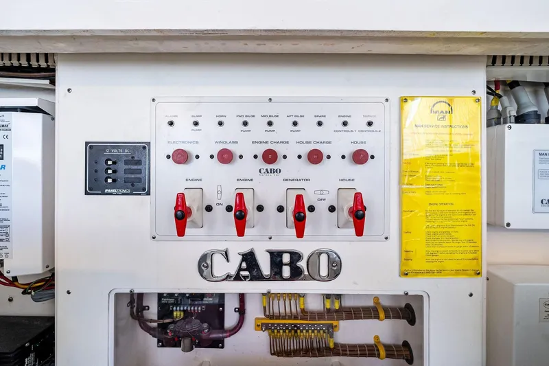 Pescador Yacht Photos Pics Electrical control panel of 2004 Cabo 40 Hardtop Express boat with switches and instructions.